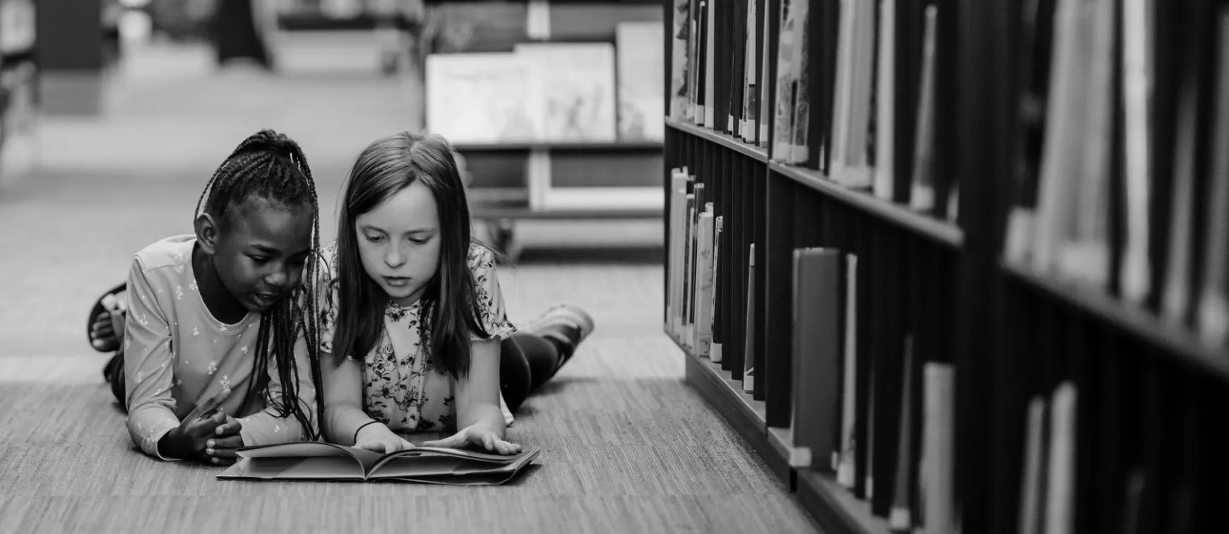 Two girls reading