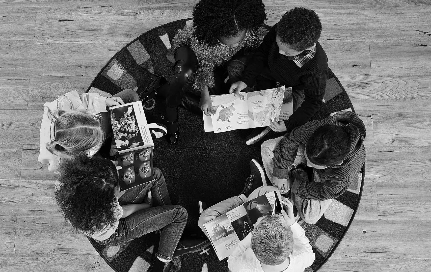 Group of children reading on the floor