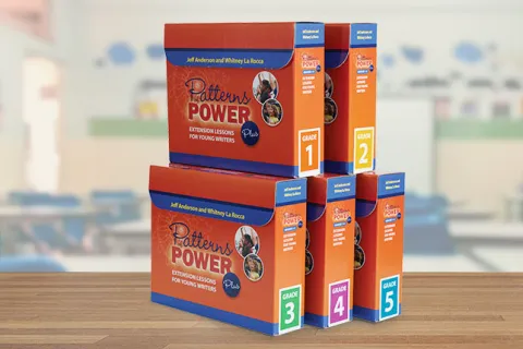 Five stacked boxes of Patterns of Power Plus grade-level kits